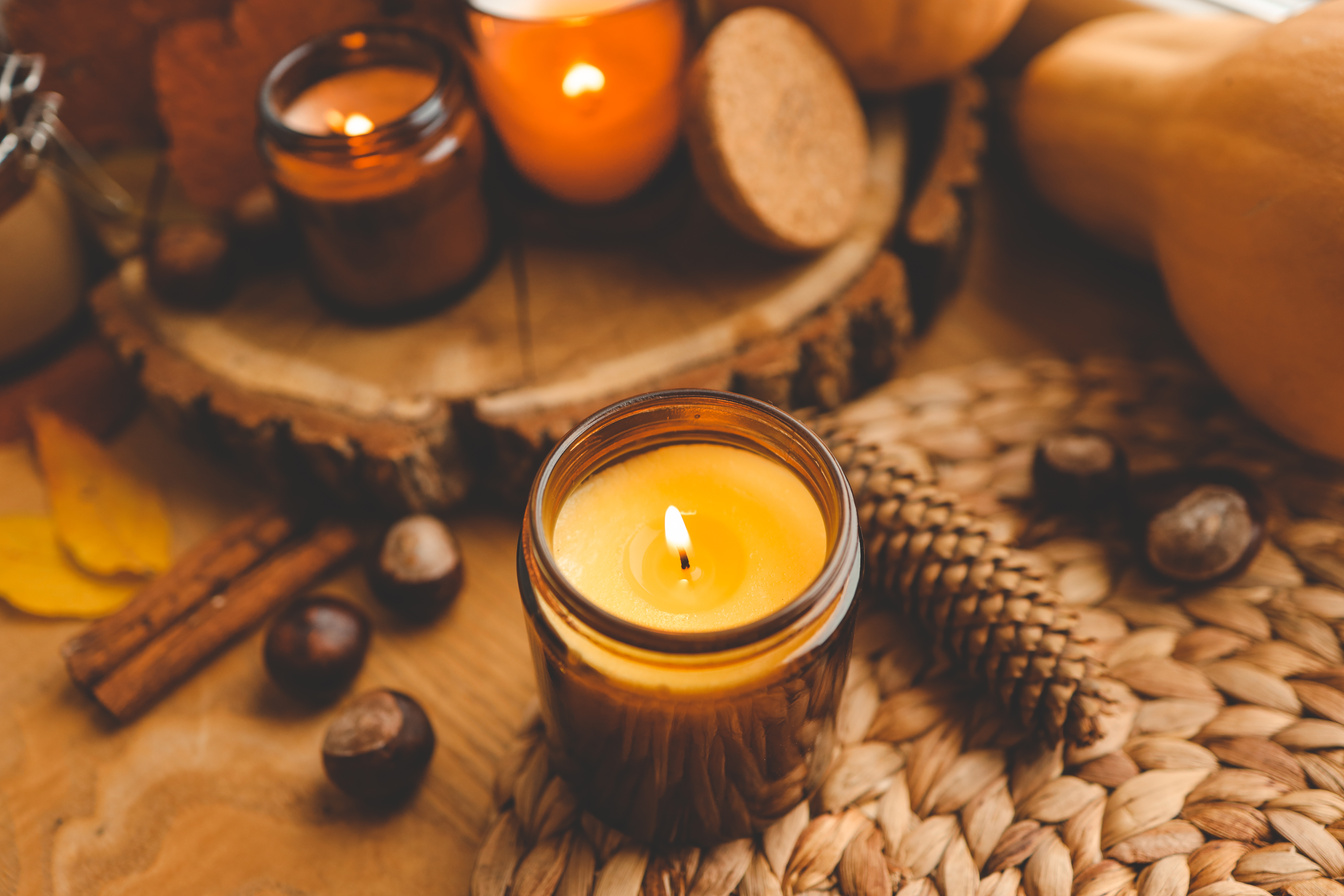 Thanksgiving autumn decor, burning candle, pumpkins and candles